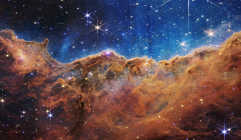 Carina Nebula displaying star formation - the gas looks like large gold mountain formations