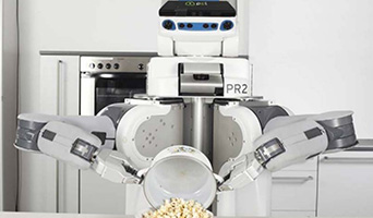 White, grey and black robot, tipping food from a pot