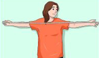 Girl measuring her arm span