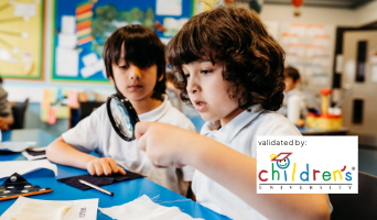 Two primary school children explore a science activity with a magnifying glass. A 'validated by Children's University' logo is displayed