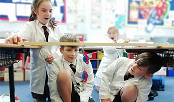 Children conducting experiment