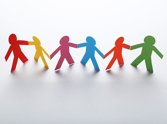 Paper chain of people holding hands