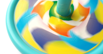 a colourful top spinning