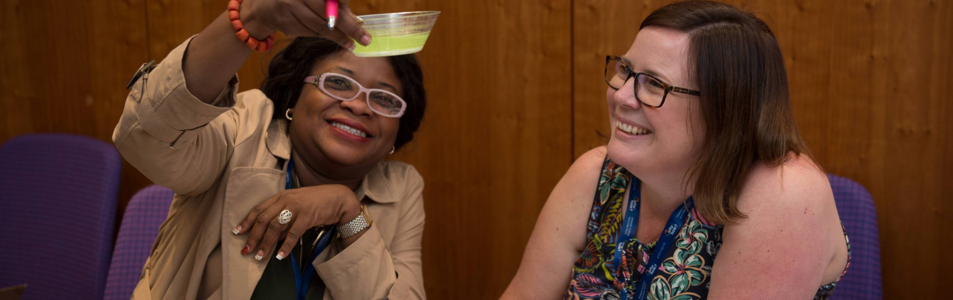 two teachers observing a liquid during CPD