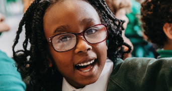 JES issue 25 cover of a primary child in the classroom